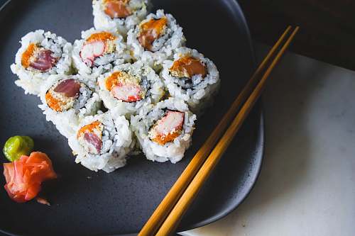 ice cream sushi food with brown wooden chopsticks cream